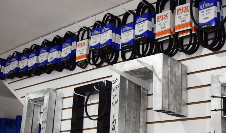 Drive belts and gate hardware hanging on the wall at RAS Kendall